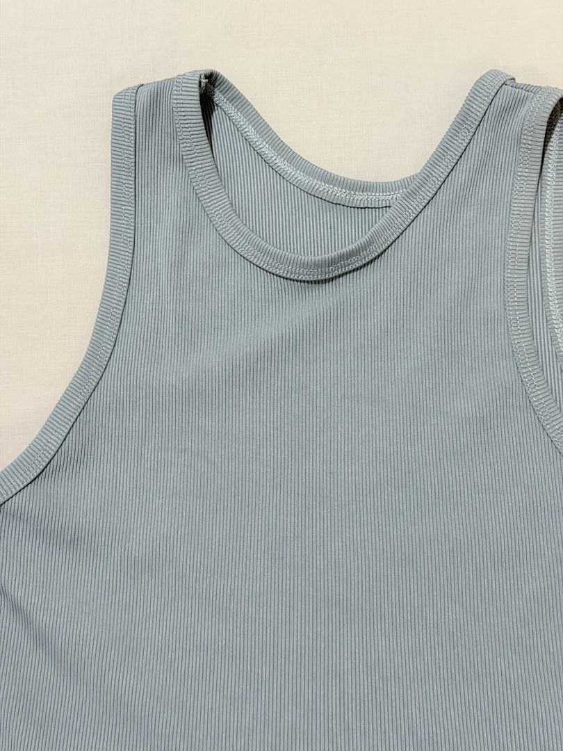 Light blue ribbed cropped tank top (Category: Sleeveless) located in Paranaque City. Submitted by hannahking36 (Listing ID 1469535084, Image 2). Description: - Color: Light blue - Style: Sleeveless racerback, cropped length - Material: Soft and stretchy ribbed knit fabric - Versatility: Perfect basic piece for everyday outfits, easy to pair with shorts, jeans, or skirts - Condition: Clean inside and out, excellent pre-loved condition.