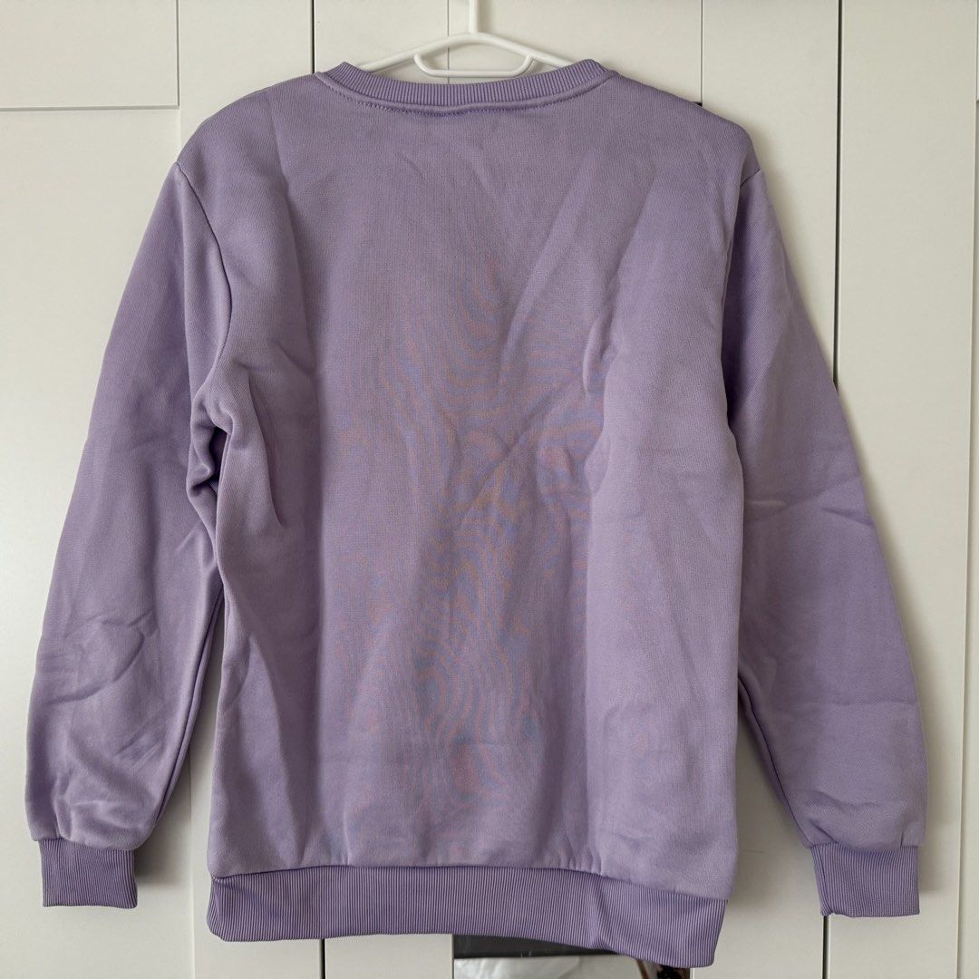 Lilac Purple Crewneck Winter Inner Layer Sweatshirt Long Sleeve Pullover (Category: Coats, Jackets and Outerwear) located in Marikina City. Submitted by lovegoeson (Listing ID 1469510455, Image 2). Description: - Inner material Fleece - Color: Pastel lilac purple - Style: Crewneck sweatshirt, standard fit pullover - Features: Long sleeves with ribbed cuffs and hem - Condition: Excellent, clean inside and out with no stains or marks - Perfect for: