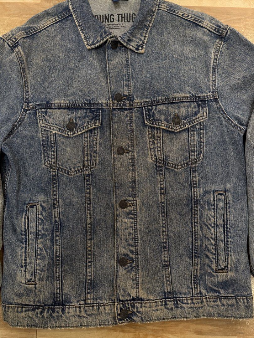 Limited Edition H&M Divided Young Thug Denim Jacket Collaboration (Category: Coats, Jackets and Outerwear) located in Manila. Submitted by epicmountain_93c71a (Listing ID 1469439494, Image 3). Description: Brand: Limited Edition H&M Divided x Young Thug Merchandise Collaboration Size: Medium (175/100A, Standard Fit) Design: Eye-catching large cherub graphic with flower bouquet and UK cities on the back Details: Distressed design, Classic button-u
