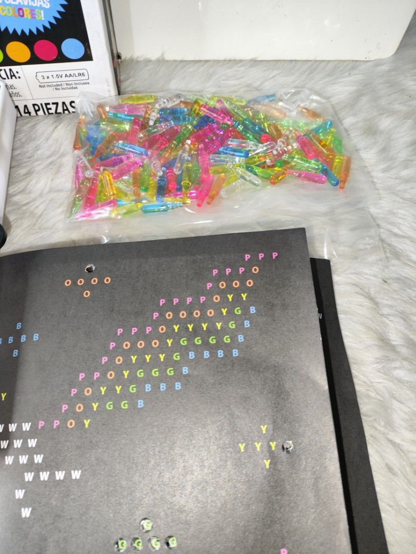 Lite-Brite Classic Retro Light-Up Toy (Category: Educational & Learning Toys) located in Cavite. Submitted by tinetaclesss (Listing ID 1469553426, Image 3). Description: Original Lite-Brite set by Basic Fun. Includes the light-up board, box, bag of colorful translucent pegs, and black design templates. Screen works and currently has a heart shape made with pegs. Great creative toy for kids. Box shows some shelf wear..