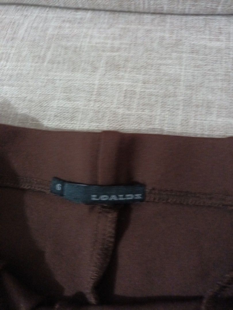 Loalde Brown Pants Size 6 (Category: Jeans) located in Quezon. Submitted by ja8720 (Listing ID 1469476692, Image 2). Description: - Brand: Loalde - Size: 6 - Color: Classic brown - Condition: Brand new with tag attached - Features: Solid design with functional front pockets - Style: Versatile and easy to match with any casual top.