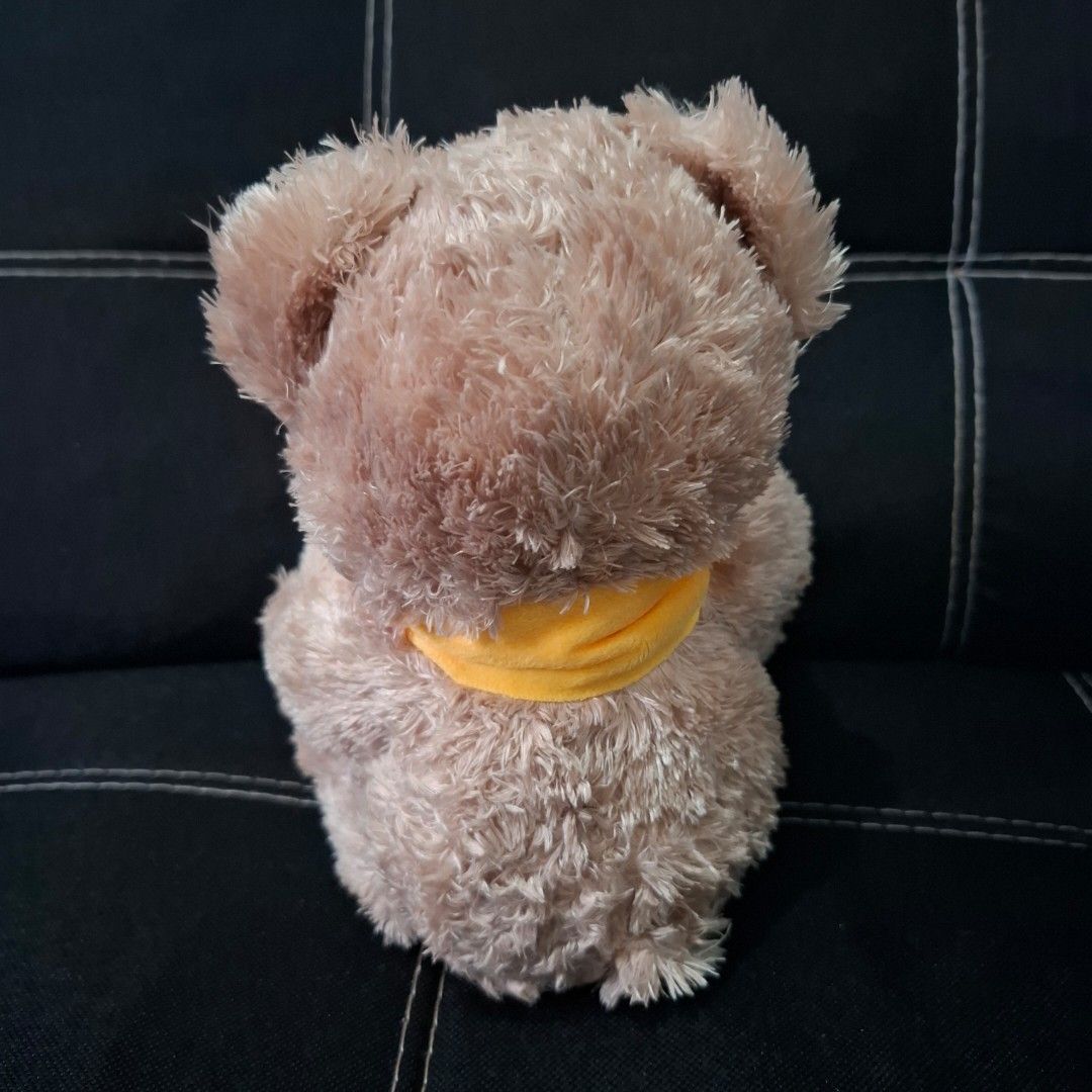 L'Occitane Teddy Bear Plush Toy (Category: Plushies & Soft Toys) located in Baliuag. Submitted by ahgashop. (Listing ID 1469470079, Image 2). Description: - Brand: L'Occitane - Item: Collectible plush teddy bear with yellow and brown honey pot - Details: Soft brown fur, yellow ribbon around the neck.