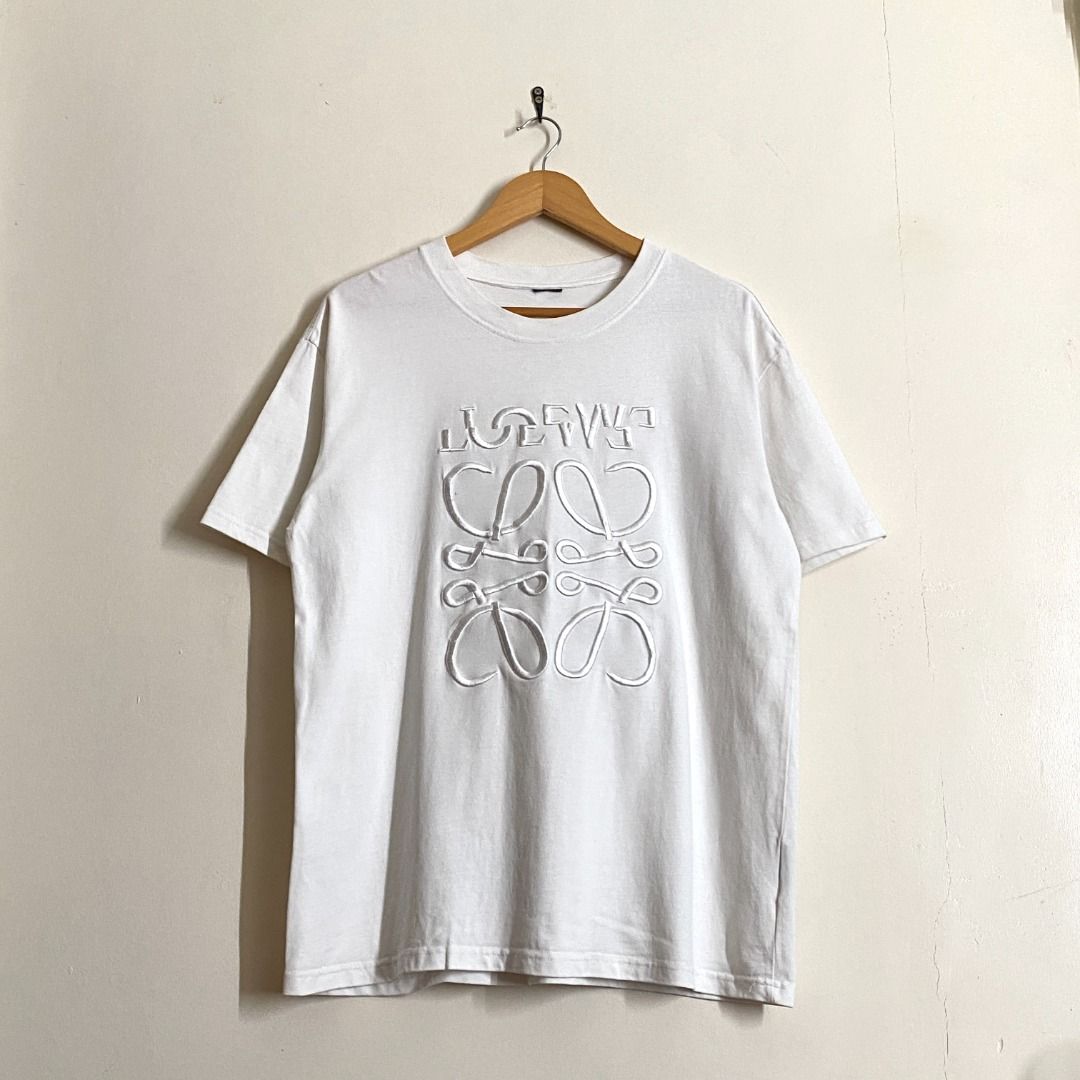 Loewe White Embroidered Anagram T-Shirt (Category: Shirts) located in Rizal. Submitted by van.b (Listing ID 1469525813, Image 2). Description: Loewe Embroidered Logo Tee 28” x 22” (L) ₱299 + shipping fee Hard-embroidered designs Issue(s): Cut tags Color Rate: 9.8 We are not affiliated or associated with any of the brands featured. All trademarks and copyrights belong to their respective owners. .