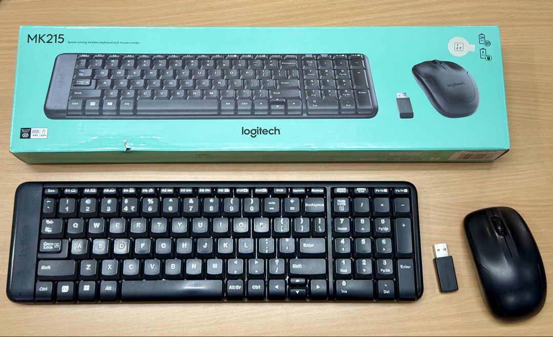 Logitech MK215 Wireless Keyboard And Mouse Combo (Category: Computer Keyboard) located in Santa Rosa. Submitted by rmp_94 (Listing ID 1469400819, Image 2). Description: - Brand: Logitech MK215 Wireless Keyboard and Mouse Combo - Condition: Original turquoise retail box included - Inclusions: Compact black wireless keyboard, black optical mouse, and USB nano receiver - Connectivity: Reliable wireless setup for desktops and laptops - Space-saving d