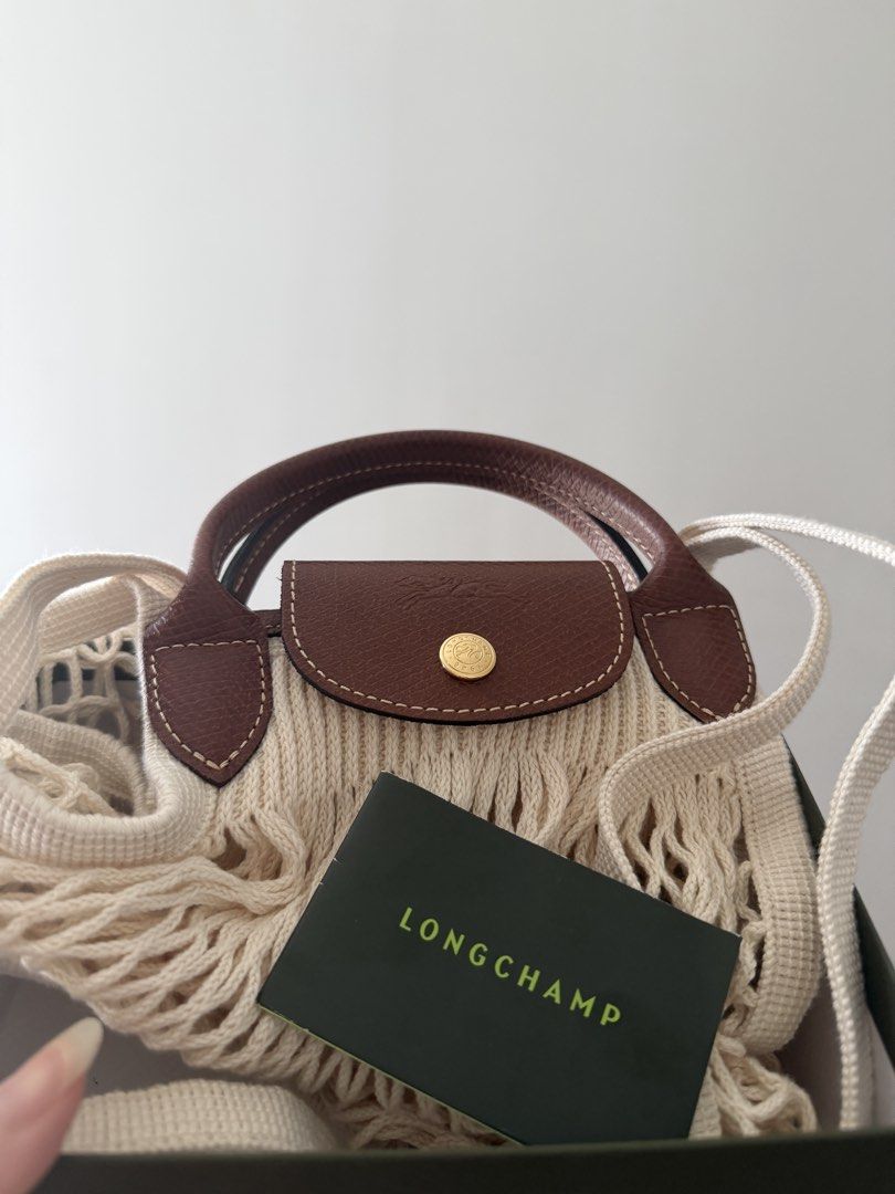 Long champ Le Pliage Filet L mesh bag (Category: Luxury Bags & Wallets) located in Taal. Submitted by yanniyana (Listing ID 1469439186, Image 1). Description: on hand and brand new.
