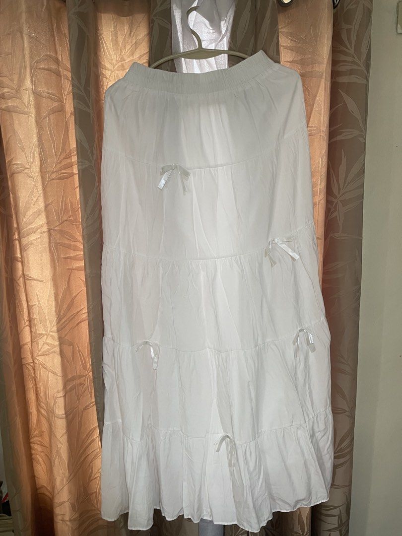 long white maxi skirt w/ bows (Category: Skirts) located in Taytay. Submitted by nixyii (Listing ID 1469438013, Image 1). Description: fits size 25 up to around size 34 (estimate) no stains, double lined! used once lang cus too long for me (im 5ft flat) 💷 gcash, bpi, cash on delivery (lalamove), cash on meetup 📦 jnt, same day delivery 📍taytay (weekends), qc (weekdays).