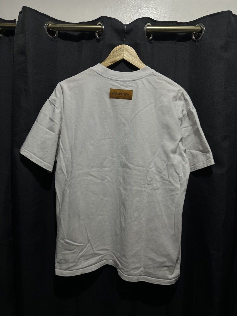 Louis Vuitton "Lovers" Embroidered Script Logo Tee (White) (Category: Tshirts & Polo Shirts ) located in Buenavista. Submitted by themodernrack (Listing ID 1469510740, Image 2). Description: NOTE: Details on photos provided, kindly check thank you Condition: Excellent condition Measurements & Sizing: Size: Tagged Size XL Width (Pit to Pit): 22” Length: 28”.