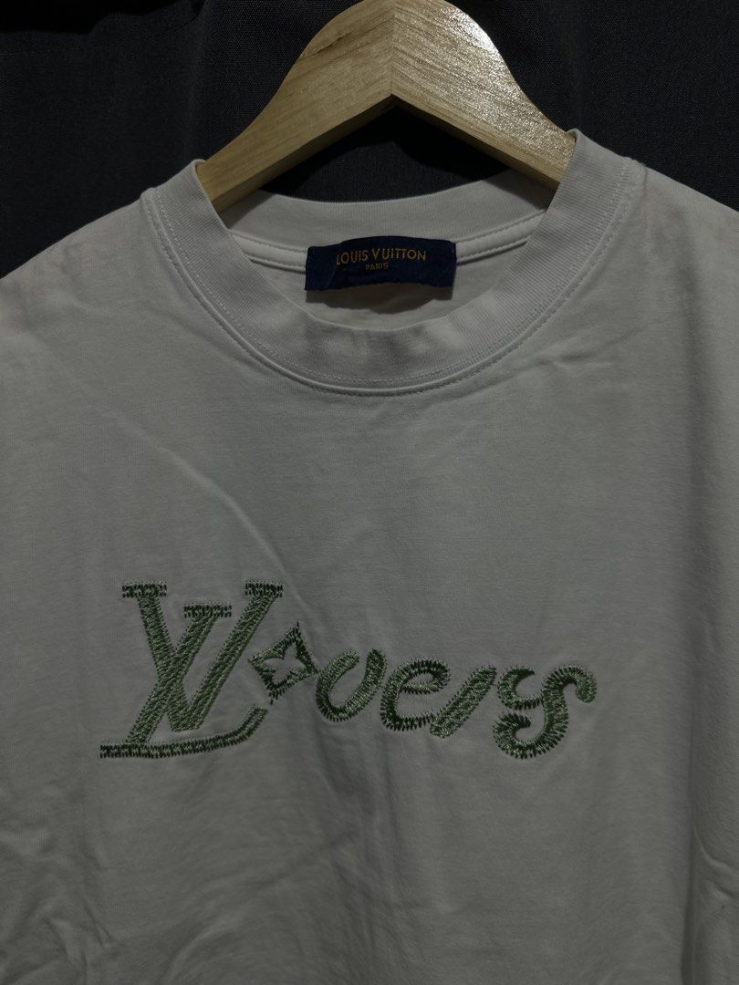 Louis Vuitton "Lovers" Embroidered Script Logo Tee (White) (Category: Tshirts & Polo Shirts ) located in Buenavista. Submitted by themodernrack (Listing ID 1469510740, Image 3). Description: NOTE: Details on photos provided, kindly check thank you Condition: Excellent condition Measurements & Sizing: Size: Tagged Size XL Width (Pit to Pit): 22” Length: 28”.