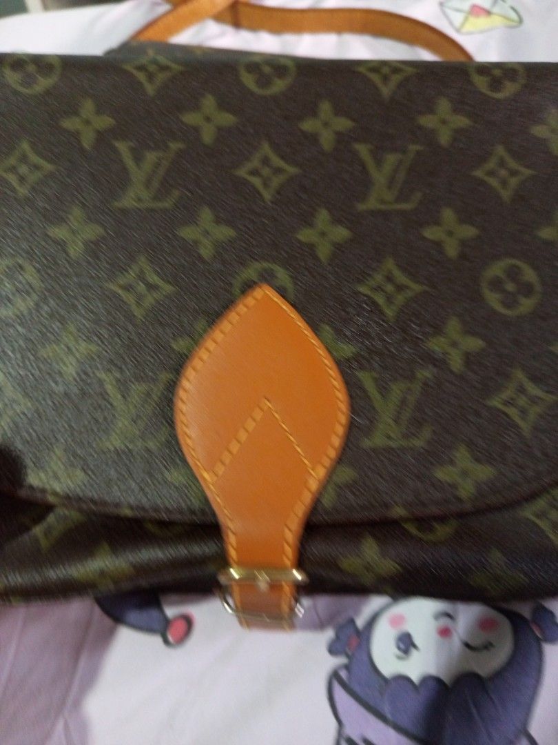 Louis Vuitton Monogram canvas Crossbody Bag (Category: Luxury Bags & Wallets) located in Gapan. Submitted by cristina_adofina (Listing ID 1469426065, Image 2). Description: - preloved Louis Vuitton crossbody bag in iconic brown monogram coated canvas - Chic tan leather front flap with secure buckle hardware .super sale na .very rare sling bag - Structured silhou.Super slae na ette with a stylish fold-over design - Convenient exterior slip pocket 