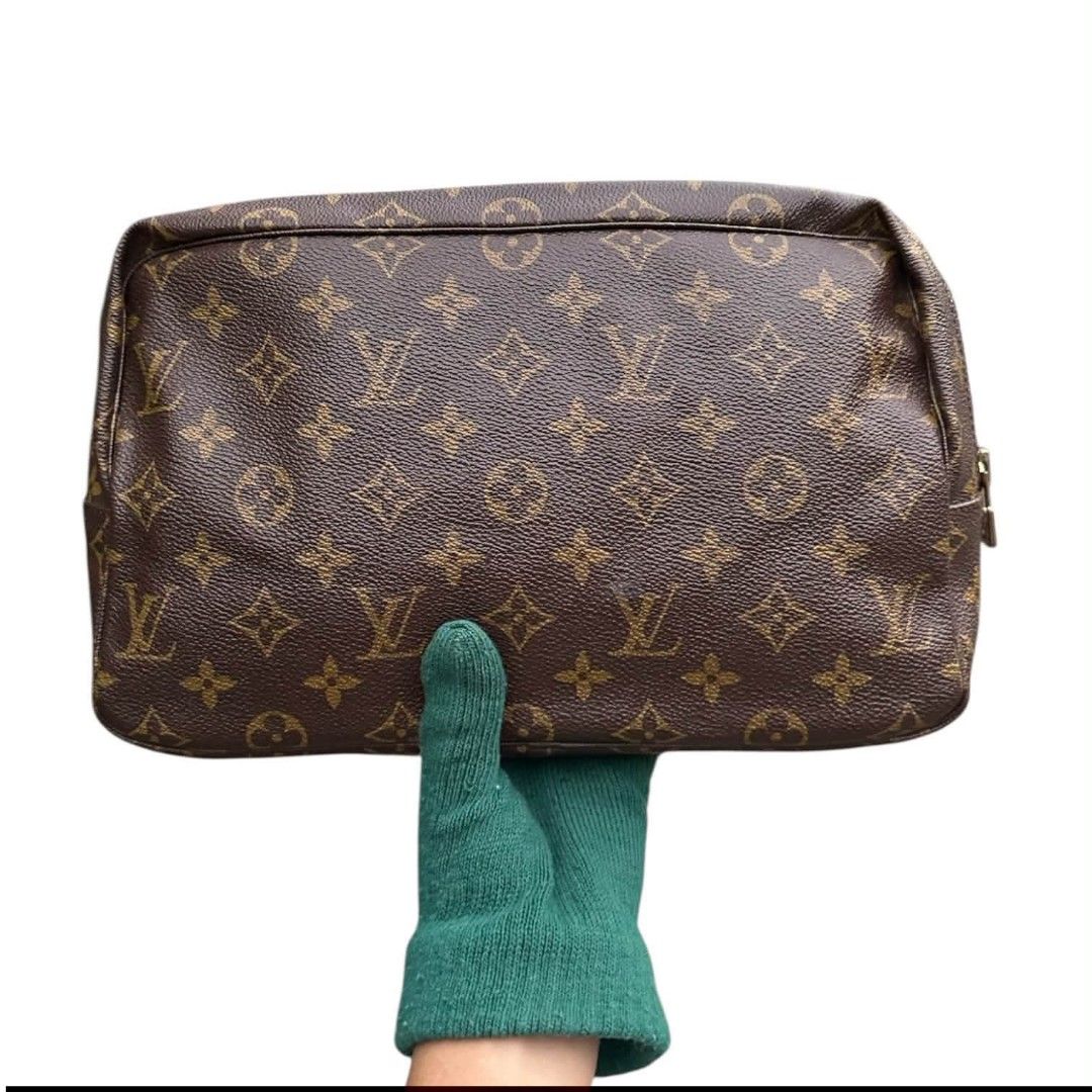 Louis Vuitton Monogram Toiletry Pouch Cosmetic Bag (Category: Luxury Bags & Wallets) located in Manila. Submitted by borbone13335092 (Listing ID 1469524186, Image 1). Description: - Authentic Louis Vuitton Classic Monogram toiletry pouch - Iconic brown canvas exterior with signature LV print - Secure top gold-tone zipper closure - Spacious rectangular interior for daily essentials and makeup - Impeccable, clean stitching along all edges - Hardwar
