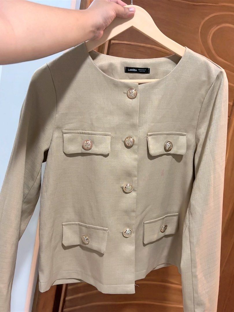 Lovito Beige Button-Up Blazer Jacket (Category: Coats, Jackets and Outerwear) located in Manila. Submitted by happydragon-9534 (Listing ID 1469520707, Image 1). Description: - Brand/Style: Lovito beige blazer - Design: Round neckline with structured fabric - Details: Gold-toned decorative buttons on the front and four pockets - Sleeves: Long sleeves - Versatility: Classic piece, easy to style for work or casual days.