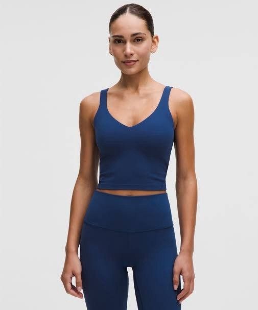 Lululemon Align Tank Top in Navy Blue (Category: Activewear) located in Gapan. Submitted by lovelypreloved1497 (Listing ID 1469403377, Image 2). Description: Letting go of this absolute workout staple—the iconic Lululemon Align Tank! Crafted from Lululemon's famous Nulu™ fabric, it feels weightless, buttery-soft, and stretches beautifully with your body. Features a flattering plunging neckline and a built-in shelf bra with pockets for removable p