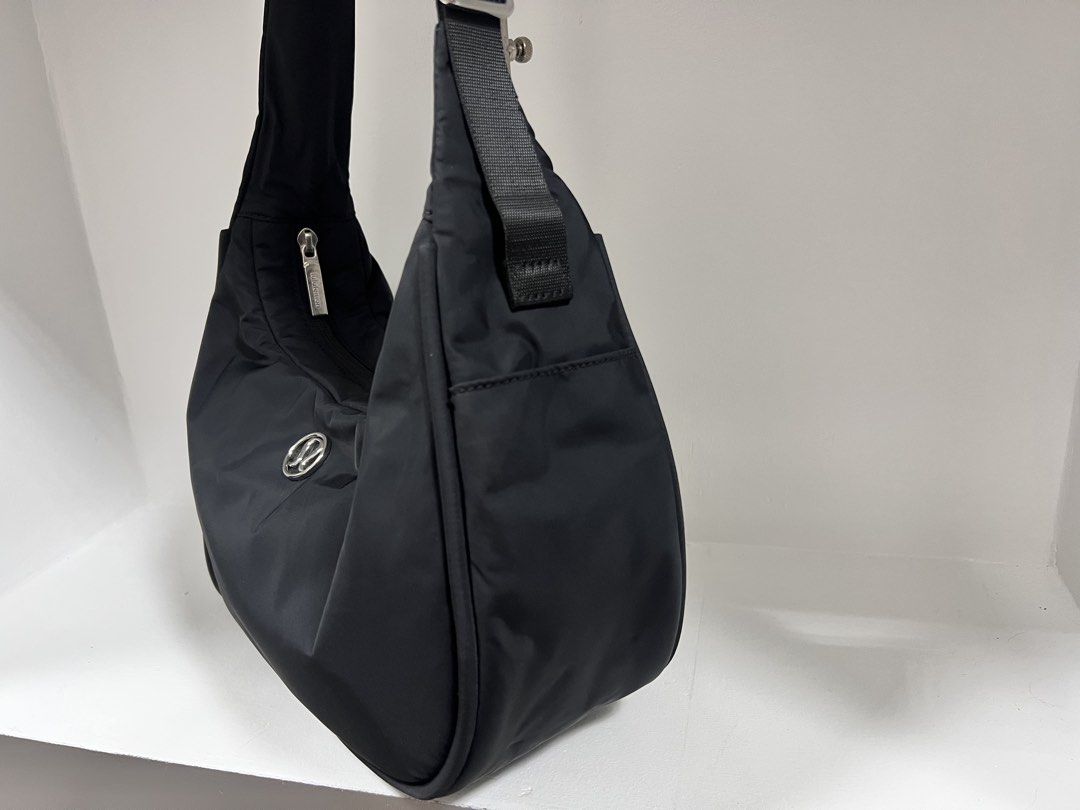 Lululemon City Essentials Shoulder Bag 4L (Category: Cross-body Bags) located in San Jose del Monte. Submitted by itstokyotokyo (Listing ID 1469394002, Image 3). Description: Authenthic💯 / Used Twice / 9.5:10 / As Is Where Is✨ - Brand: Lululemon - Color: Classic Black - Material: Clean, lightweight nylon with silver-tone hardware - Design: Practical crescent shape with front logo emblem - Storage: Main zip compartment + exterior zippered pocket 