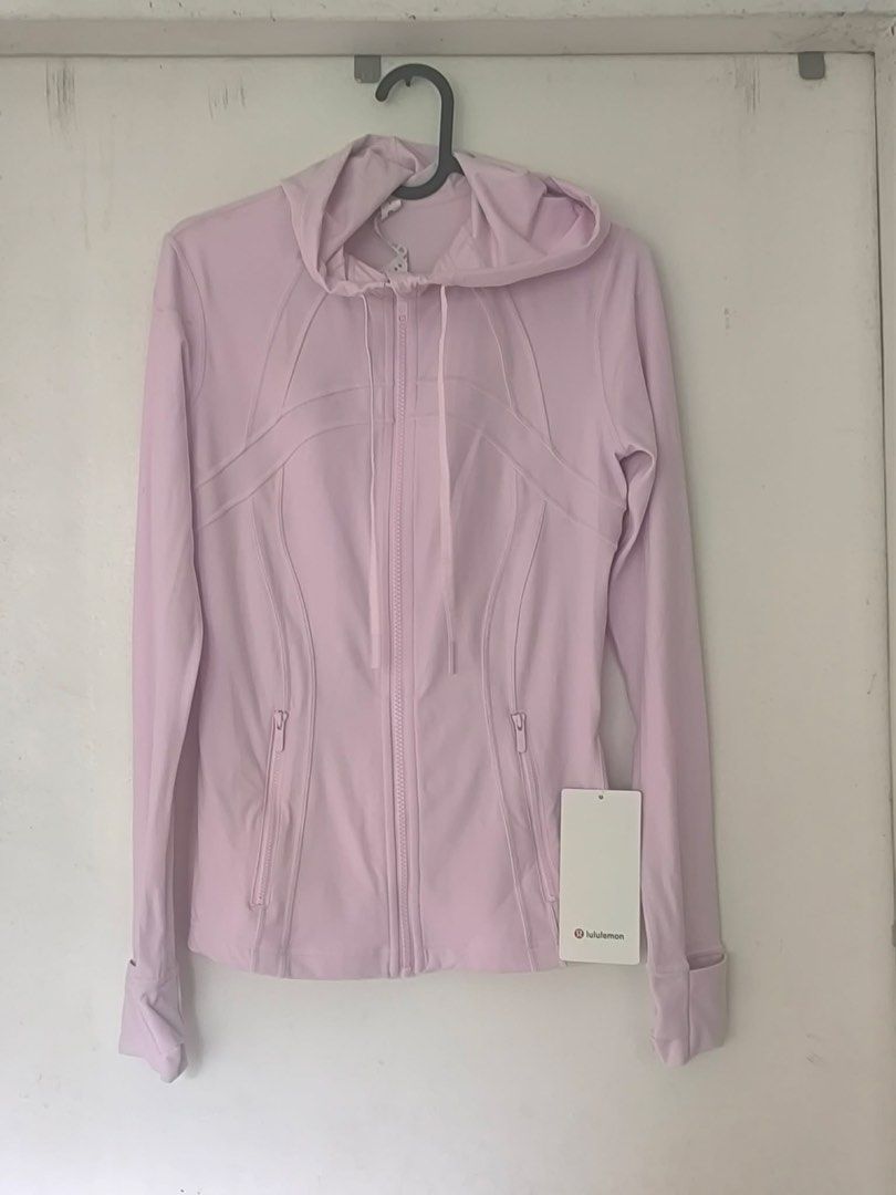 Lululemon Define Jacket Light Pink Hooded (Category: Coats, Jackets and Outerwear) located in Makati City. Submitted by xiaolongbaosgf (Listing ID 1469485222, Image 1). Description: Brand new Lululemon Define Jacket in soft light pink, size and fit are flattering with a zip front, hood, thumbholes, and secure pockets. Original store tag still attached. Perfect for workouts or casual wear! SIZE: XS rfs: decluttering.
