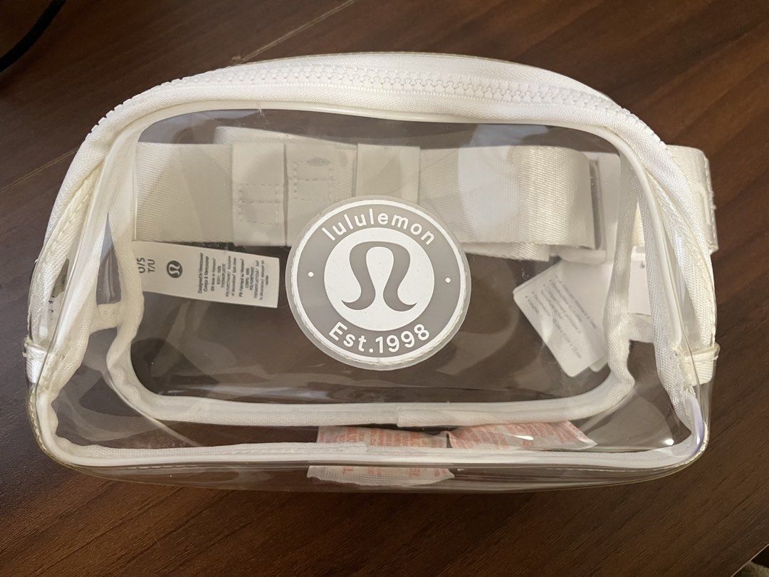 Lululemon Everywhere Belt Bag Transparent White (Category: Belt bags, Clutches and Pouches) located in Cebu City. Submitted by jsal79 (Listing ID 1469520905, Image 2). Description: - Brand new with original tags attached (barcode visible) - Color: Transparent White with white strap and trim - Stadium-ready clear design for concerts, festivals, and games - Features the classic round Lululemon Est. 1998 logo patch - Adjustable white strap for versa