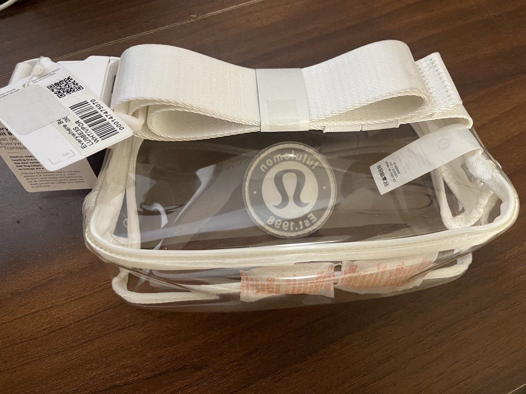 Lululemon Everywhere Belt Bag Transparent White (Category: Belt bags, Clutches and Pouches) located in Cebu City. Submitted by jsal79 (Listing ID 1469520905, Image 1). Description: - Brand new with original tags attached (barcode visible) - Color: Transparent White with white strap and trim - Stadium-ready clear design for concerts, festivals, and games - Features the classic round Lululemon Est. 1998 logo patch - Adjustable white strap for versa