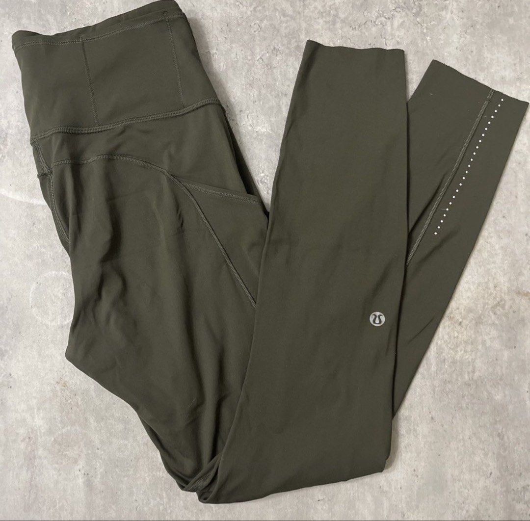 Lululemon Olive Green Leggings with Pockets (Category: Activewear) located in General Trias. Submitted by abellu (Listing ID 1469517111, Image 1). Description: - Brand: Lululemon - Color: Dark Olive Green - Rise: High-rise waistband for ultimate comfort and support - Pockets: Deep side drop-in pockets that easily fit smartphones plus back waistband storage - Safety: Reflective dot details near the lower leg cuffs for low-light visibility - Brandi
