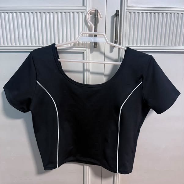 Lululemon Set (Category: Sets or Coordinates) located in Manila. Submitted by zendog_a92acc (Listing ID 1469466215, Image 1). Description: - Color: Black with white piping and accents - Set includes: Short sleeve crop top (wide scoop neck) and high-waist skirt - Material: Stretchy, comfortable fabric - Versatile use: Ideal for tennis, workouts, or casual streetwear - Condition: Brand new / Excellent quality - Mode of Payment: GCash or Bank Transf