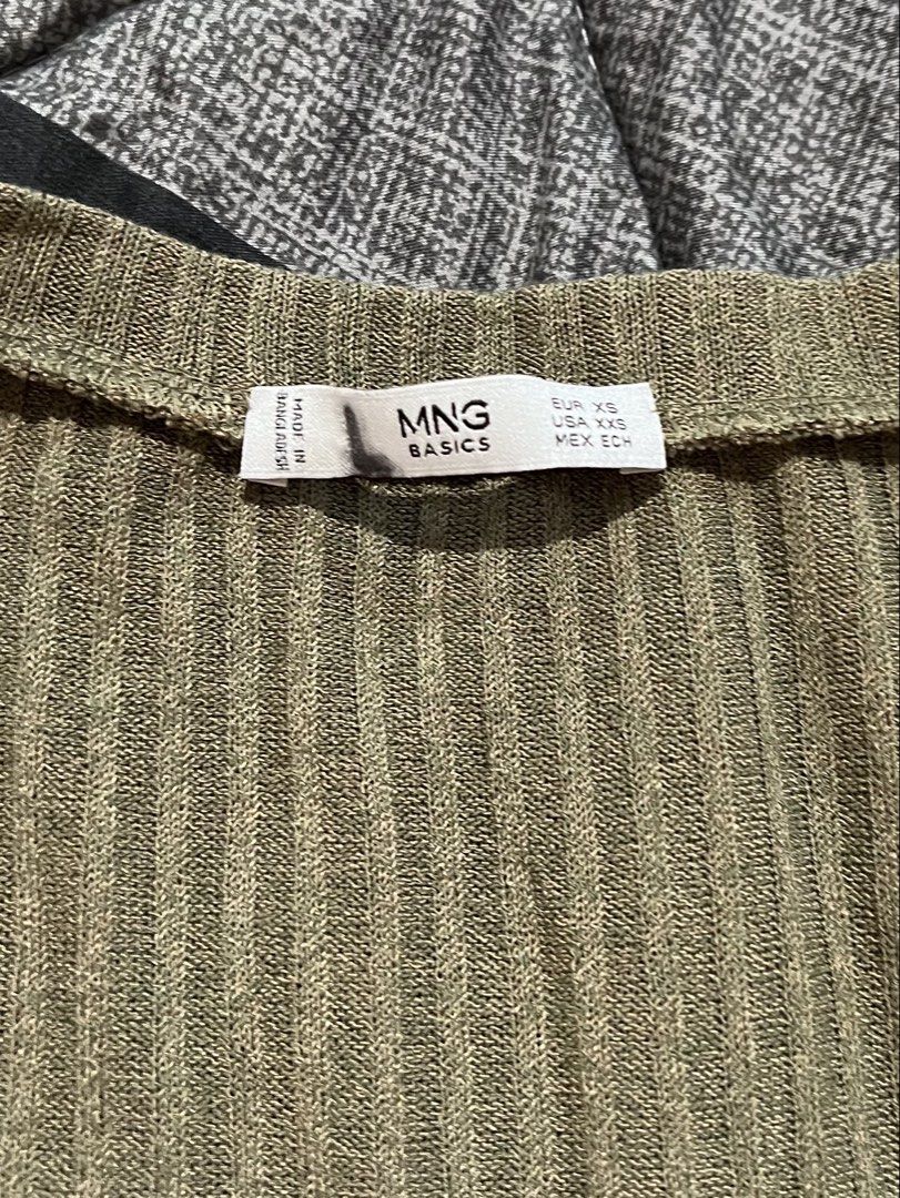 MANGO Basics Olive Green Ribbed Tank Top (Category: Sleeveless) located in Manila. Submitted by sph_preloved (Listing ID 1469523616, Image 2). Description: Price not negotiable unless buying at least 5 items. No ww photos. Location: QC Mode of delivery: grab/lalamove SF to be shouldered by the buyer .