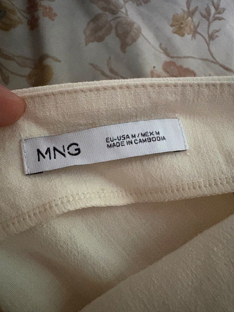 Mango Cream Camisole Top Size M (Category: Sleeveless) located in Pasig City. Submitted by makeuplover219 (Listing ID 1469437022, Image 3). Description: - Brand: MNG Mango - Size: Medium (M) - Color: Cream - Design: low neckline with thin spaghetti straps and ruched side detail - Versatile piece, easy to dress up or down - SF: c/o buyer Grab, Gogo Express, and Lalamove.