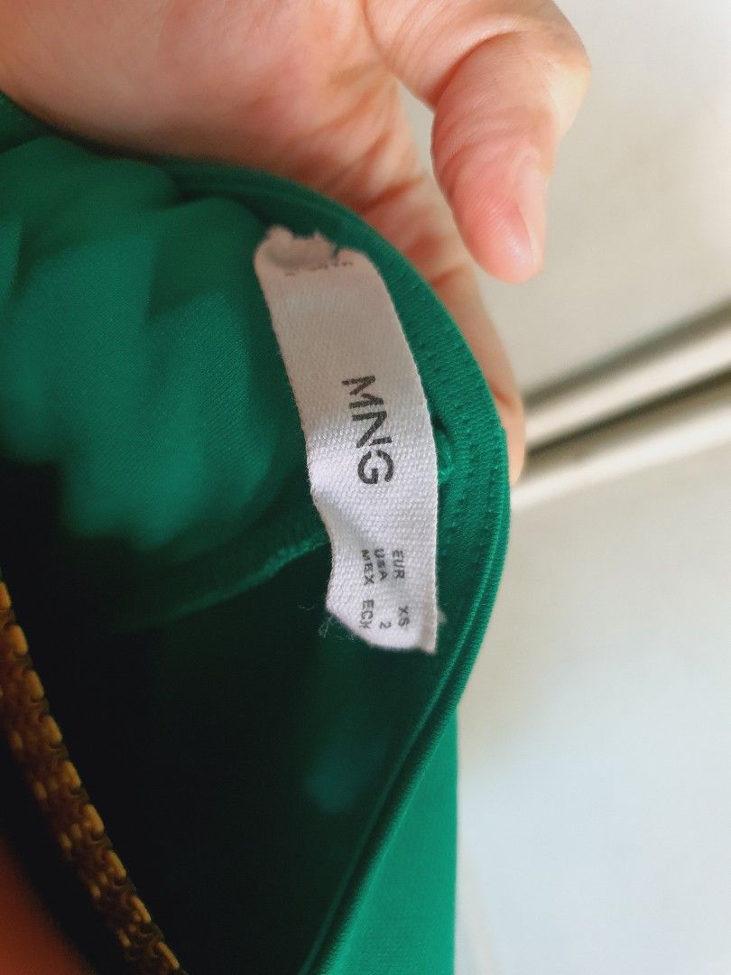 MANGO Green WRAP Dress Size XS (Category: Dresses) located in Quezon City. Submitted by carbonfootprint (Listing ID 1469550536, Image 3). Description: - Brand: Mango - Color: Solid green - Size: EUR XS / USA 2, ANKLE-Length for 5'1" - Material: 69% polyester, 31% recycled polyester - Style: V-neckline, cap sleeves, wrap style with side waist tie - Length: 31 inches from waist to hem - Condition: Great piece, simple and classic for party or office