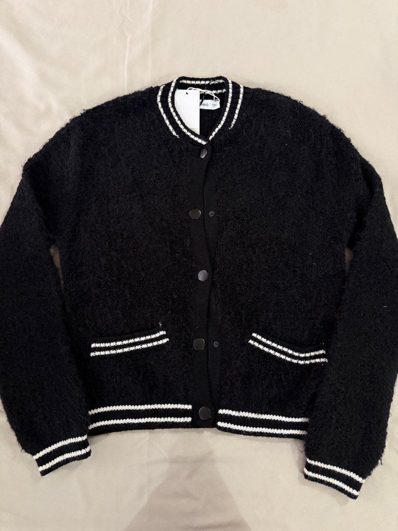 Mango Knitted Bomber Jacket Black Size L (Category: Coats, Jackets and Outerwear) located in Caloocan City. Submitted by triciadrilvs (Listing ID 1469441081, Image 1). Description: - Brand: Mango - Item: Knitted Bomber Jacket - Color: Black with contrast white striped ribbed trim (collar, cuffs, hem, and pockets) - Closure: Snap button front - Pockets: Two functional front pockets - Size: L - Condition: Brand new with original store tags attached