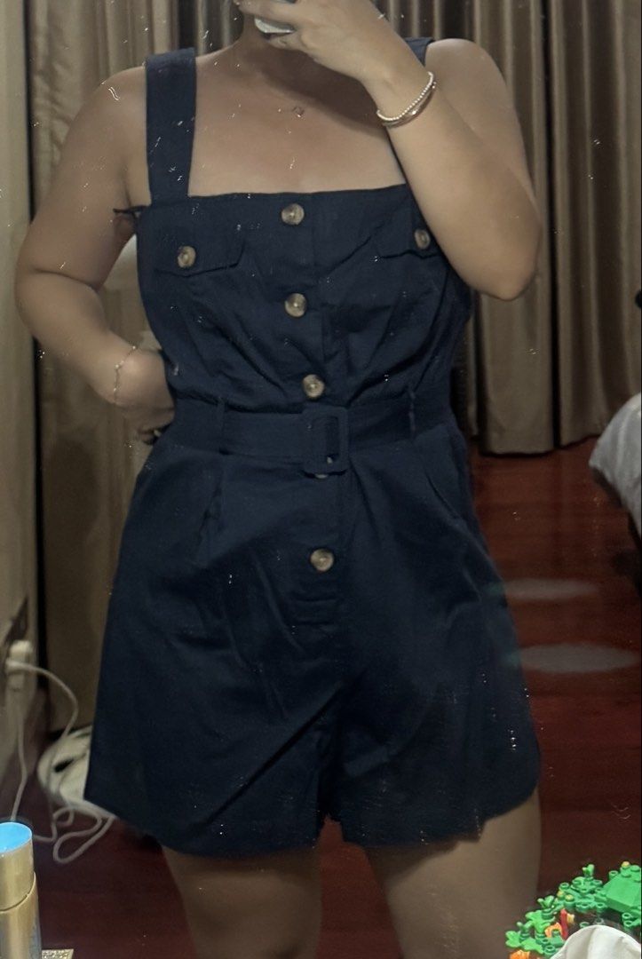 Mango Navy Blue Button-Up Romper with Belt (Category: Rompers) located in Manila. Submitted by cjy041 (Listing ID 1469412244, Image 3). Description: - brand new with tag - got it on sale - Color: Dark blue - Style: Utility romper with shorts - Neckline & Straps: Square neckline with wide straps - Closure & Pockets: Front button closure and chest pocket flap details LOCATION: STA CRUZ, MANILA .