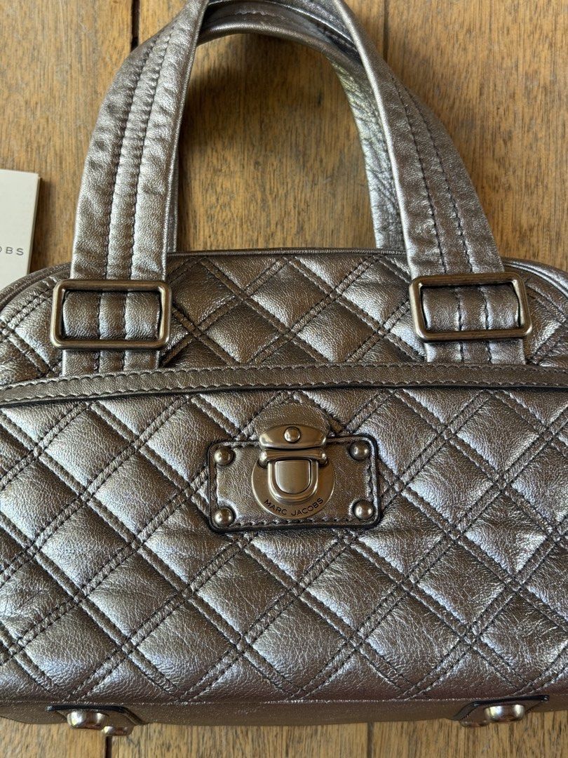 MARC JACOBS Ursula Bowler (Category: Luxury Bags & Wallets) located in Davao. Submitted by _iconculture (Listing ID 1469525636, Image 2). Description: AVAILABLE • MARC JACOBS Ursula Bowler Bag ★ A standout piece from the Fall/Winter 2007 collection. Condition: 9.8/10 — Almost mint condition! Has small rubs that is barely noticeable. Clean interior and very well-kept structure. Spacious enough to fit your daily essentials and more! Has front and b