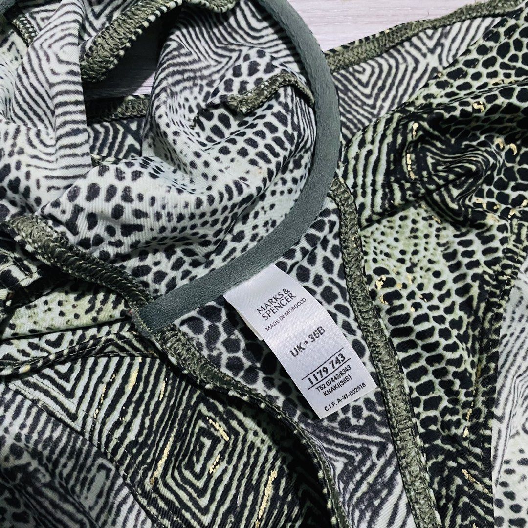 Marks & Spencer Khaki Animal Print Bikini Set (Category: Bikinis & Swimsuits) located in Caloocan City. Submitted by lovemyclothes21 (Listing ID 1469496683, Image 2). Description: - Brand: Marks & Spencer - Color: Khaki with geometric & animal print + subtle gold foil flecks - Top: Underwired, adjustable straps, size UK 36B - Bottoms: High-waisted, size Medium - Origin: Made in Morocco - Condition: Excellent / Ready to wear.