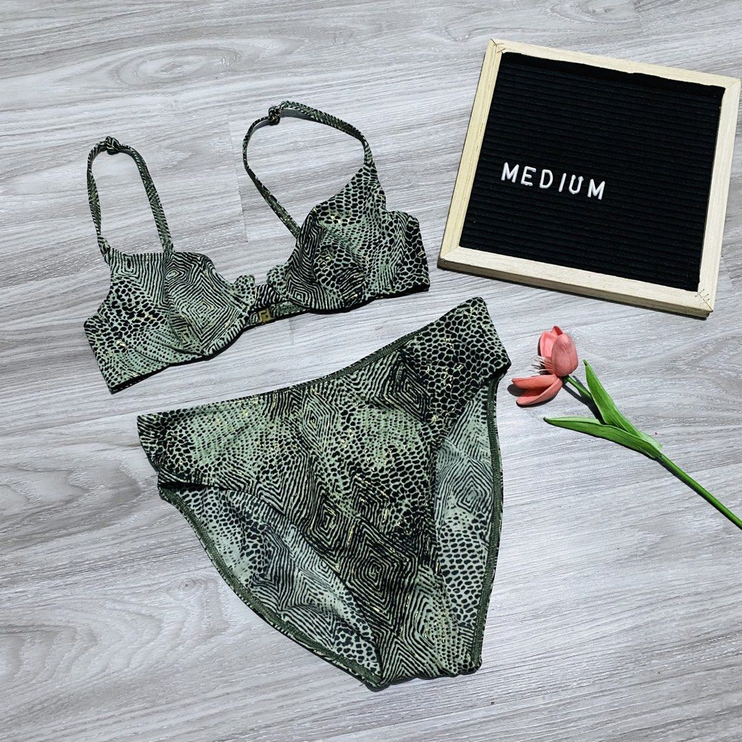 Marks & Spencer Khaki Animal Print Bikini Set (Category: Bikinis & Swimsuits) located in Caloocan City. Submitted by lovemyclothes21 (Listing ID 1469496683, Image 1). Description: - Brand: Marks & Spencer - Color: Khaki with geometric & animal print + subtle gold foil flecks - Top: Underwired, adjustable straps, size UK 36B - Bottoms: High-waisted, size Medium - Origin: Made in Morocco - Condition: Excellent / Ready to wear.