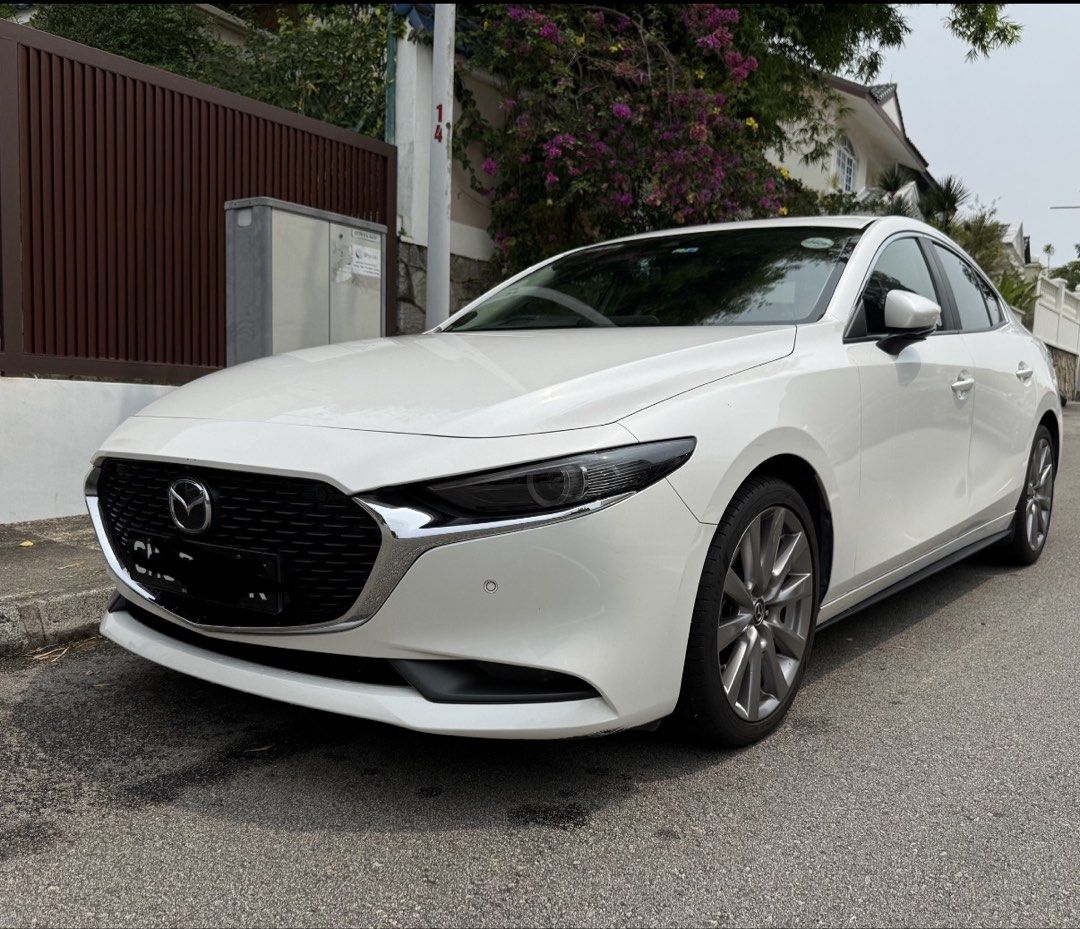 Mazda 3 Sedan Mild Hybrid 1.5 Elegance (A) (Category: Used Cars) located in Singapore. Submitted by honestsell21 (Listing ID 1469428126, Image 2). Description: Selling our beloved car, well maintained and low mileage! More than 3 years left! *IMPT* will only transfer ownership once new car is secured. Quick Facts • Model: Mazda 3 Mild Hybrid Sedan Elegance with Sunroof • Engine: 1,496cc petrol-electric (mild hybrid), auto, 118 bhp • Colour: White
