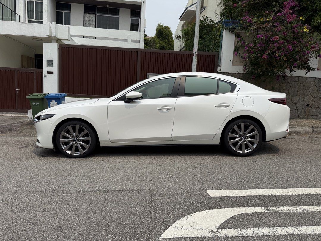 Mazda 3 Sedan Mild Hybrid 1.5 Elegance (A) (Category: Used Cars) located in Singapore. Submitted by honestsell21 (Listing ID 1469428126, Image 3). Description: Selling our beloved car, well maintained and low mileage! More than 3 years left! *IMPT* will only transfer ownership once new car is secured. Quick Facts • Model: Mazda 3 Mild Hybrid Sedan Elegance with Sunroof • Engine: 1,496cc petrol-electric (mild hybrid), auto, 118 bhp • Colour: White