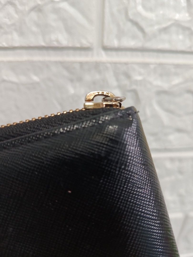 MCM Black Zipped Long Wallet (Category: Luxury Bags & Wallets) located in Cagayan de Oro. Submitted by pastel829 (Listing ID 1469448308, Image 3). Description: - Brand: MCM - Material: Textured Saffiano leather - Color: Black with gold-tone hardware - Closure: Secure zip-around - Exterior: Iconic MCM München metal plaque - Interior: Multiple card slots, slip compartments, and zippered coin pocket - Lining: MCM jacquard fabric - Condition: Clean i