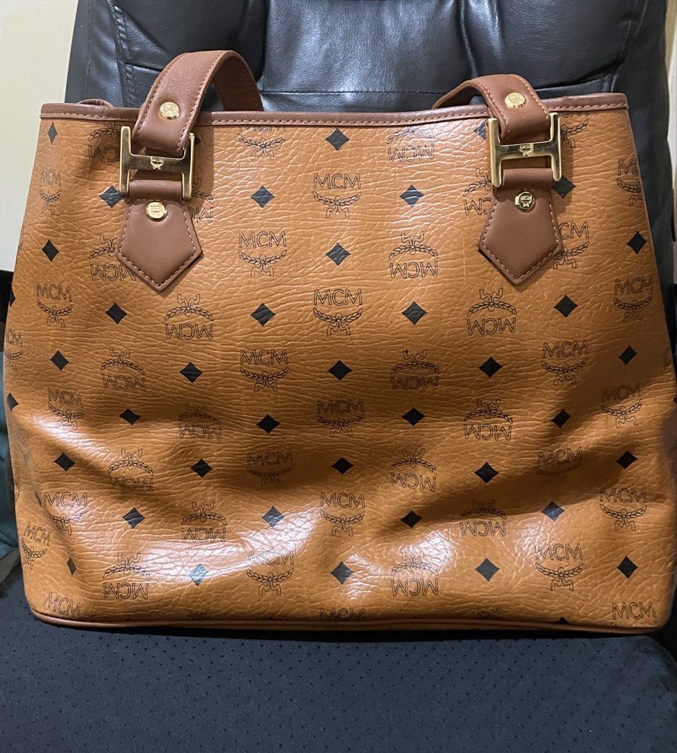 MCM Cognac Tote Bag (Category: Luxury Bags & Wallets) located in Cavite. Submitted by HelloAnn_Closet (Listing ID 1469568884, Image 2). Description: Visetos Crocodile Embossed Medium Liz Shopper Tote Cognac Very spacious. .