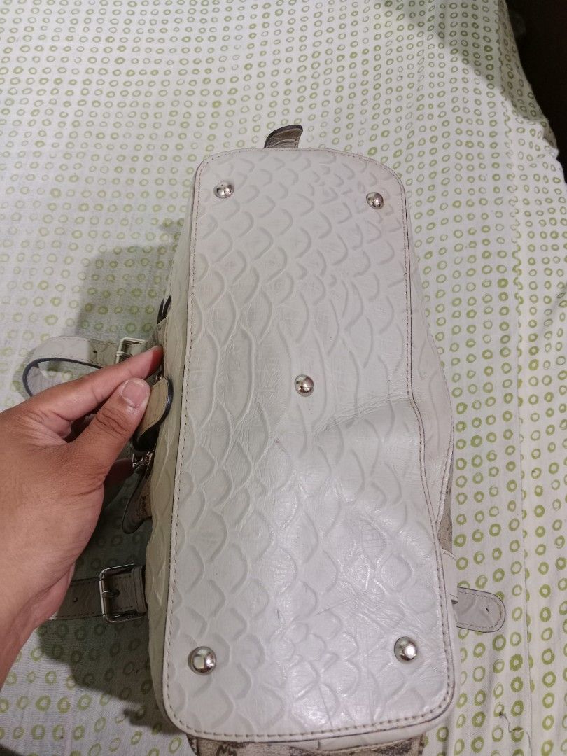 MCM Monogram Tote Handbag with Dual Straps and Pockets (Category: Luxury Bags & Wallets) located in Bacolod City. Submitted by jorengrate26639 (Listing ID 1469436493, Image 3). Description: - Vintage Authentic MCM Tote Bag beige monogram canvas - Elegant white leather trim with dual buckle-detail shoulder handles - Functional exterior front pocket and side utility pockets with buckle closures - Secure zip-top closure with branded hardware pulls -
