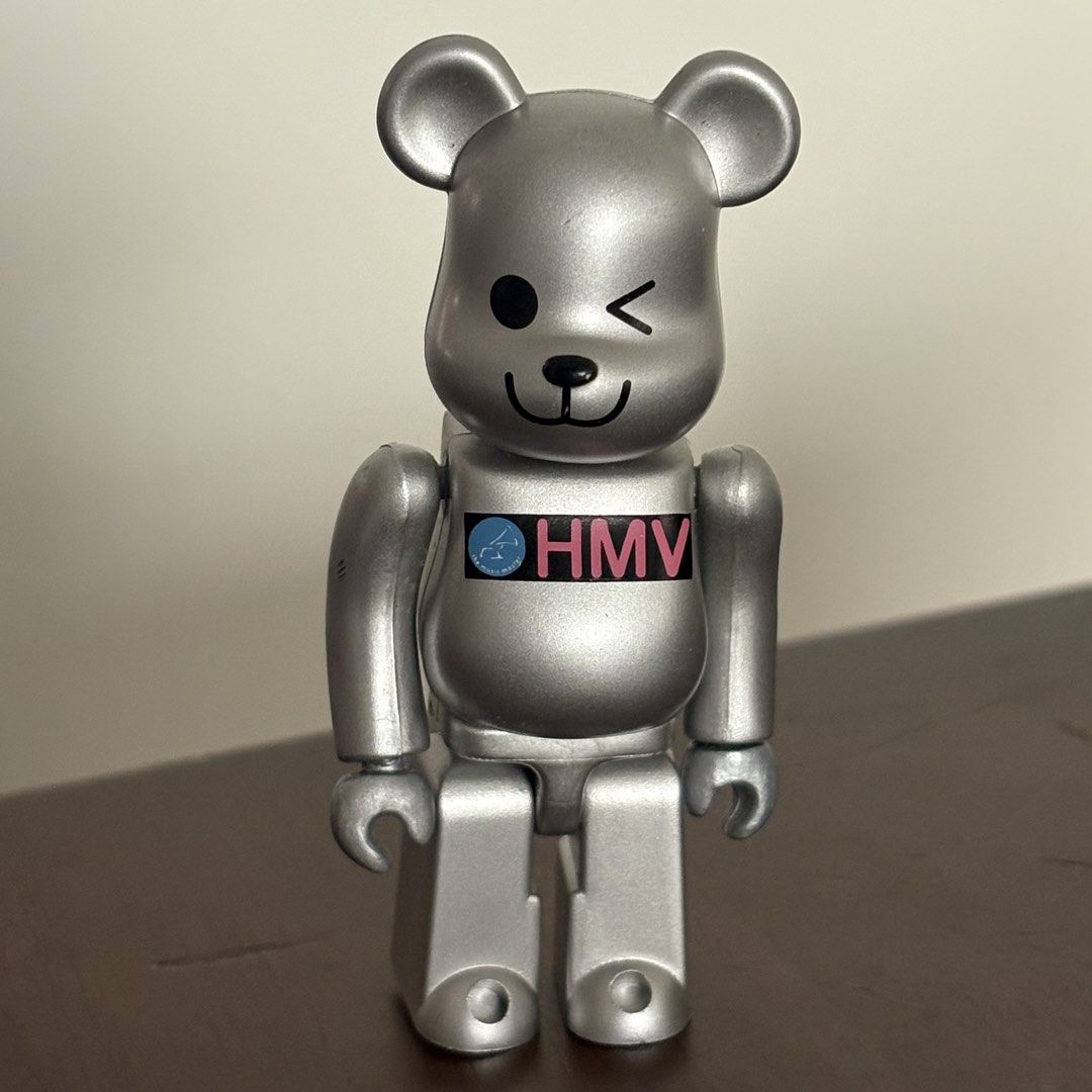 Medicom Toy Be@rbrick HMV Silver 100% (Category: Designer & Blind Box Toys) located in Manila. Submitted by aobacafe (Listing ID 1469456776, Image 1). Description: - Authentic Medicom Toy Be@rbrick (Dated 2001 stamped on back) - Rare silver finish with iconic HMV logo across the chest - Features a cute winking face design on the front - Stands firmly on its own.