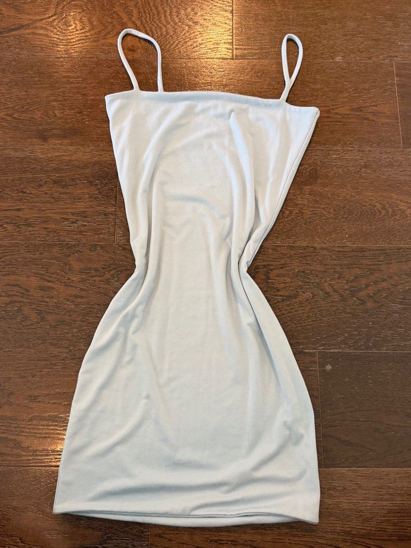 Mera Light Blue Spaghetti Strap Mini Dress Size XS (Category: Dresses) located in Quezon City. Submitted by lililiadluns (Listing ID 1469434454, Image 1). Description: - Brand/Style: Mera light blue sleeveless mini dress - Size: XS - Details: Thin spaghetti straps and scoop neckline - Fabric: Smooth and stretchy knit for a form-fitting bodycon silhouette - Quality: Clean stitching with a minimalist style - Origin: Made in the Philippines.