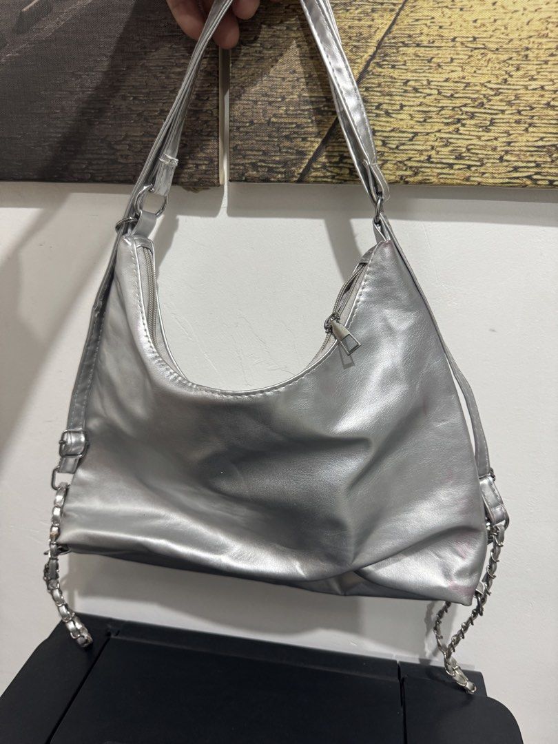Metallic Silver Shoulder Bag with Planet Embellishment (Category: Shoulder Bags) located in Imus. Submitted by budolfindsimus (Listing ID 1469504036, Image 3). Description: 🪐 Y2K SILVER HOBO BAG - TRENDING PLANET CHARM! ✨ 2-WAY BAG - HOBO & bag pack Ang ganda sis! Pang Gen Z, pang tita, pang awra! 😍 DETAILS: Style: 2-WAY - Hobo Shoulder Bag + bag pack Material: Premium Faux Leather / Metallic Vegan Leather Shiny Silver - kumikinang talaga sa pe