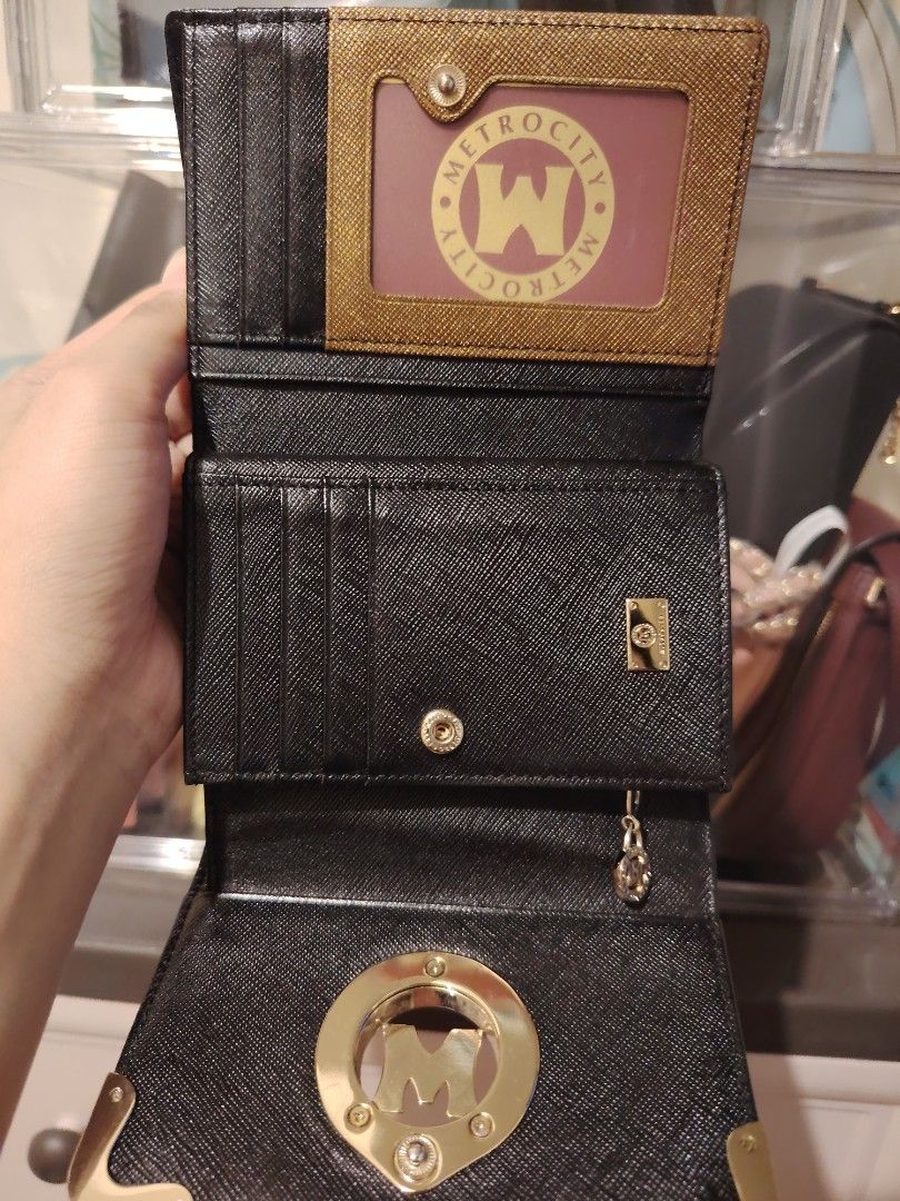 Metrocity Black Tri-fold Wallet with Gold Hardware (Category: Luxury Bags & Wallets) located in Quezon City. Submitted by chantillycee (Listing ID 1469471739, Image 2). Description: expects signs of use: - minimal fading/hairline sa hardware, gold pa - wala naman gaano scratch or rubs sa body - malinis, no foul smell - overall ok pa condition 8.5/10 qc.