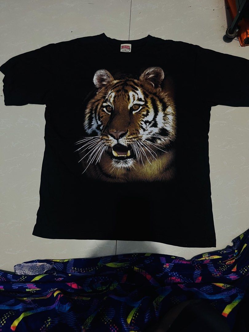 Michael Athletic Dept Tiger Graphic Tee Black XL (Category: Tshirts & Polo Shirts ) located in Manila. Submitted by athan0800 (Listing ID 1469483451, Image 1). Description: - Brand/Tag: Michael Athletic Dept - Size: XL (Relaxed fit) - Material: 100% soft cotton - Design: Bold, highly detailed tiger face graphic - Neckline: Classic crew neck - Color: Solid black.