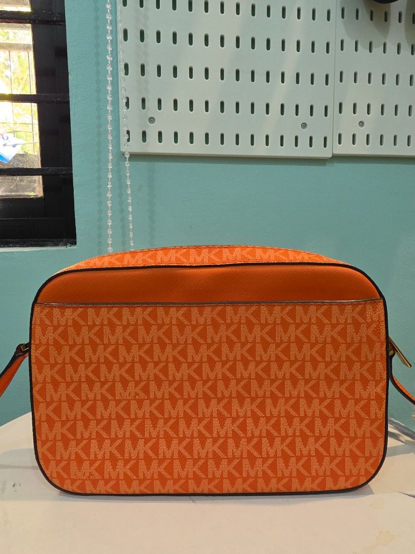 Michael Kors Bag Crossbody bag with tag (Category: Luxury Bags & Wallets) located in Agdangan. Submitted by closetbysamita (Listing ID 1469500090, Image 2). Description: Michael Kors Large Jet Set Bag Orange with tag intact Good as new (Used few times) Php 2800 Canada outlet Nuvali, Calamba, Cabuyao.