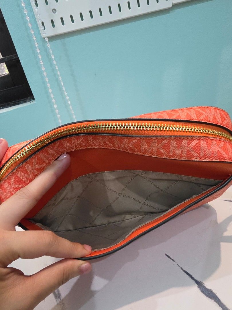 Michael Kors Bag Crossbody bag with tag (Category: Luxury Bags & Wallets) located in Agdangan. Submitted by closetbysamita (Listing ID 1469500090, Image 3). Description: Michael Kors Large Jet Set Bag Orange with tag intact Good as new (Used few times) Php 2800 Canada outlet Nuvali, Calamba, Cabuyao.