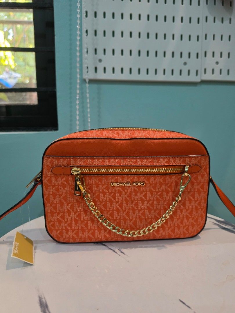 Michael Kors Bag Crossbody bag with tag (Category: Luxury Bags & Wallets) located in Agdangan. Submitted by closetbysamita (Listing ID 1469500090, Image 1). Description: Michael Kors Large Jet Set Bag Orange with tag intact Good as new (Used few times) Php 2800 Canada outlet Nuvali, Calamba, Cabuyao.