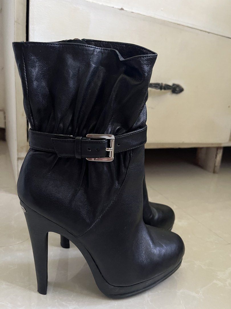 Michael Kors Black Leather Heeled Boots Size 6.5M (Category: Boots) located in Vintar. Submitted by layla.ly (Listing ID 1469447739, Image 1). Description: - Michael Kors - Black leather boots with high stiletto heel and front platform - Size: 6.5 - Design details: Slouchy upper, buckled strap accent, full side zipper with branded pull tab - Materials: Leather upper, rubber sole - inner has a washable stain Price is still negotiable MOP: GCASH/GO
