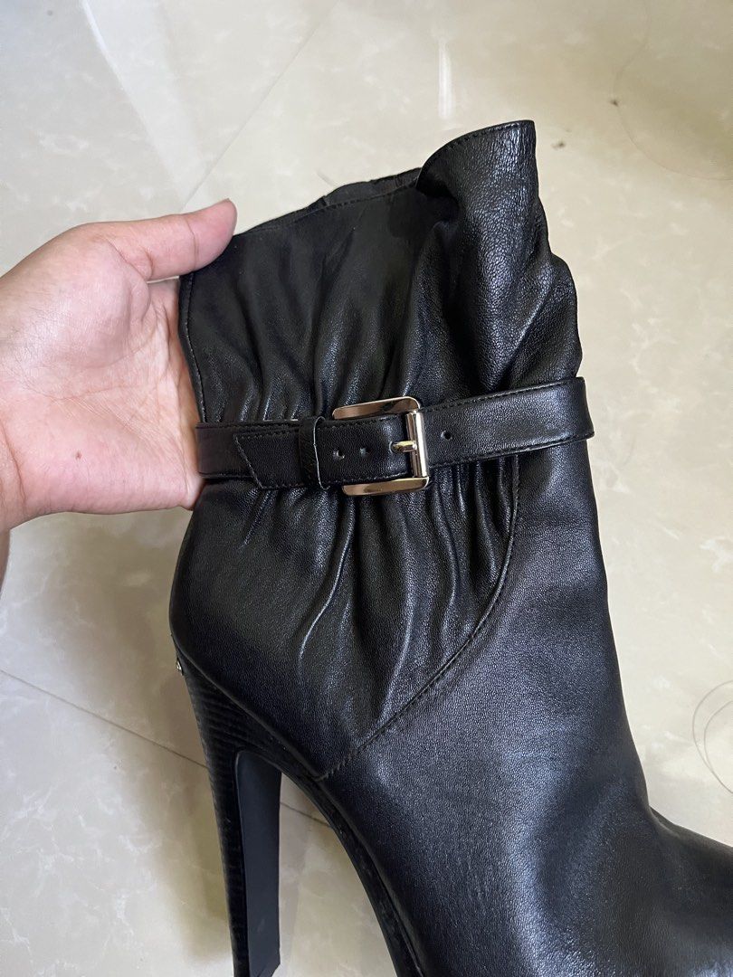 Michael Kors Black Leather Heeled Boots Size 6.5M (Category: Boots) located in Vintar. Submitted by layla.ly (Listing ID 1469447739, Image 2). Description: - Michael Kors - Black leather boots with high stiletto heel and front platform - Size: 6.5 - Design details: Slouchy upper, buckled strap accent, full side zipper with branded pull tab - Materials: Leather upper, rubber sole - inner has a washable stain Price is still negotiable MOP: GCASH/GO