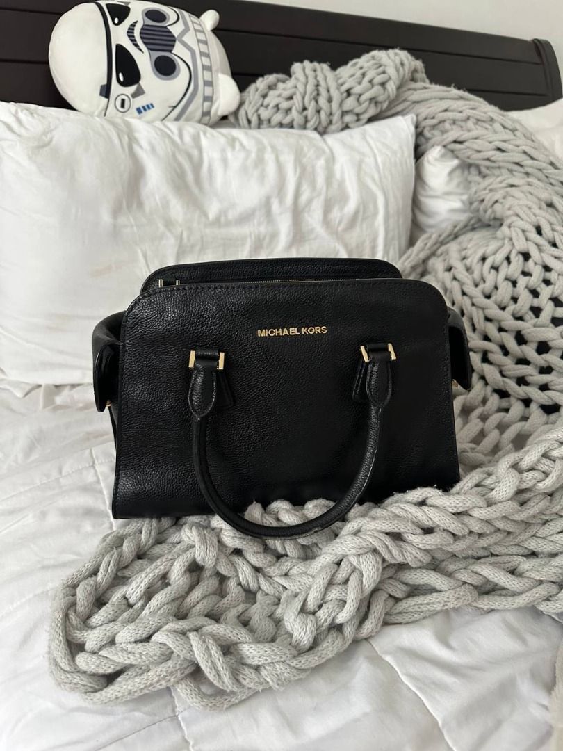 Michael Kors Black Leather Satchel Handbag (Category: Luxury Bags & Wallets) located in Quezon City. Submitted by flipandfind (Listing ID 1469426818, Image 1). Description: rarely used, sold as is, no other inclusions - Brand: Michael Kors - Material: Premium black pebble leather - Hardware: Elegant gold-tone hardware - Closure: Secure zip-top main compartment - Handles: Double top handles with metal details - Interior: Includes smaller pockets a