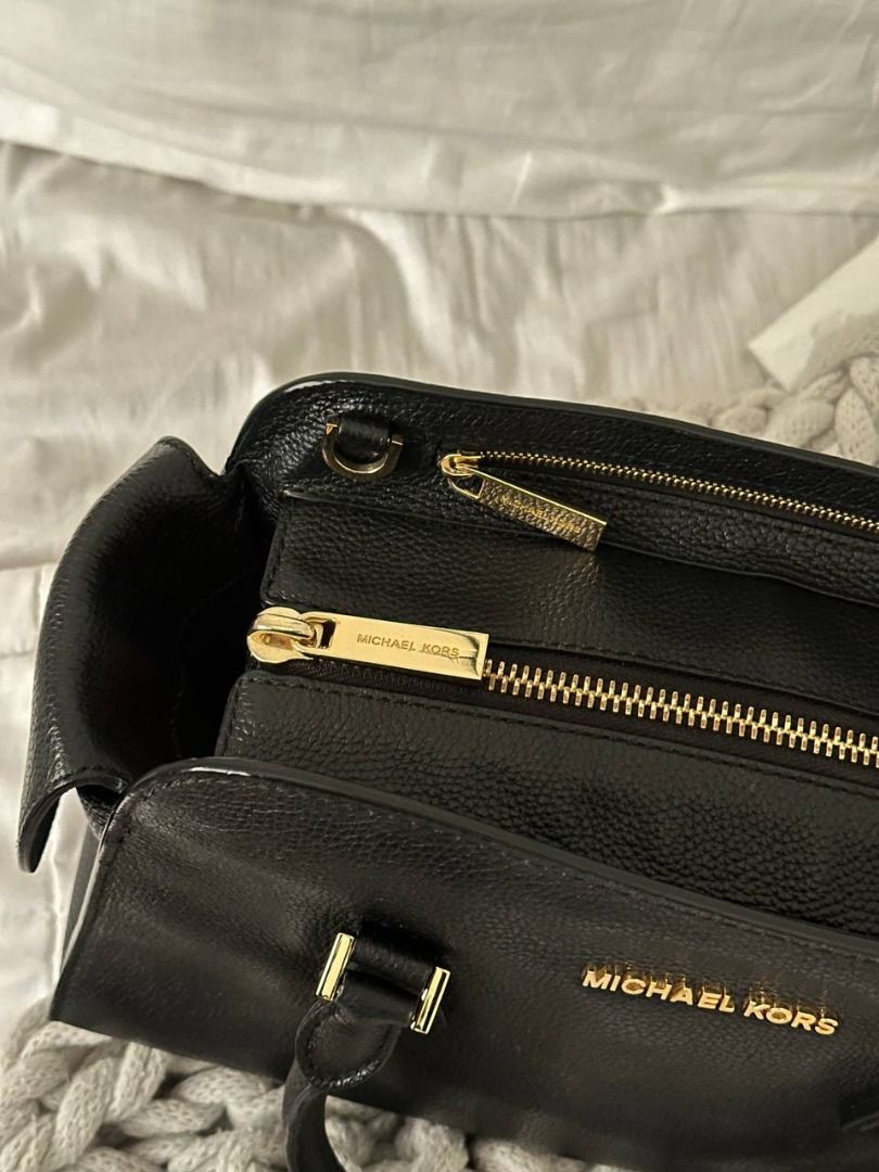 Michael Kors Black Leather Satchel Handbag (Category: Luxury Bags & Wallets) located in Quezon City. Submitted by flipandfind (Listing ID 1469426818, Image 2). Description: rarely used, sold as is, no other inclusions - Brand: Michael Kors - Material: Premium black pebble leather - Hardware: Elegant gold-tone hardware - Closure: Secure zip-top main compartment - Handles: Double top handles with metal details - Interior: Includes smaller pockets a