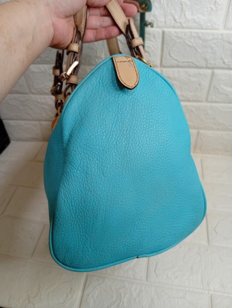 Michael Kors Grayson Medium Satchel Bag (Category: Shoulder Bags) located in Las Pinas. Submitted by etoksi1234 (Listing ID 1469558429, Image 3). Description: Pre-loved Michael Kors Grayson Medium Satchel in an aquamarine or turquoise leather finish, accented with gold-tone hardware, square stud details, dual top handles, and a signature hanging "MK" circular logo charm..