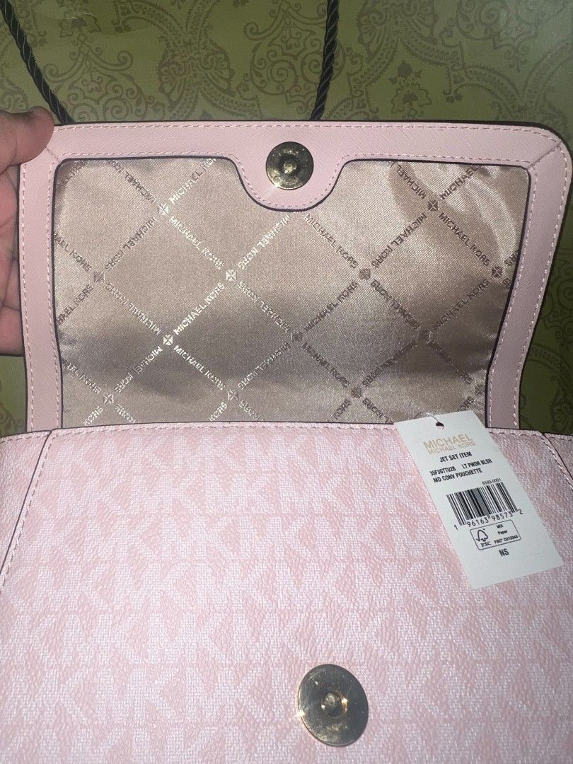 Michael Kors Jet Set Light Ceossbody Bag (Category: Luxury Bags & Wallets) located in Cebu City. Submitted by jomjomhernando31-16115 (Listing ID 1469550331, Image 2). Description: - Brand: Michael Kors - Style: Jet Set Item Medium Convertible Pouchette (Style No: 35F3GTTU2B) - Colorway: Light Powder Blush pink with signature MK monogram print - Hardware: Gold-tone - Condition: Brand new with original store tag attached - Strap: Removable and adju