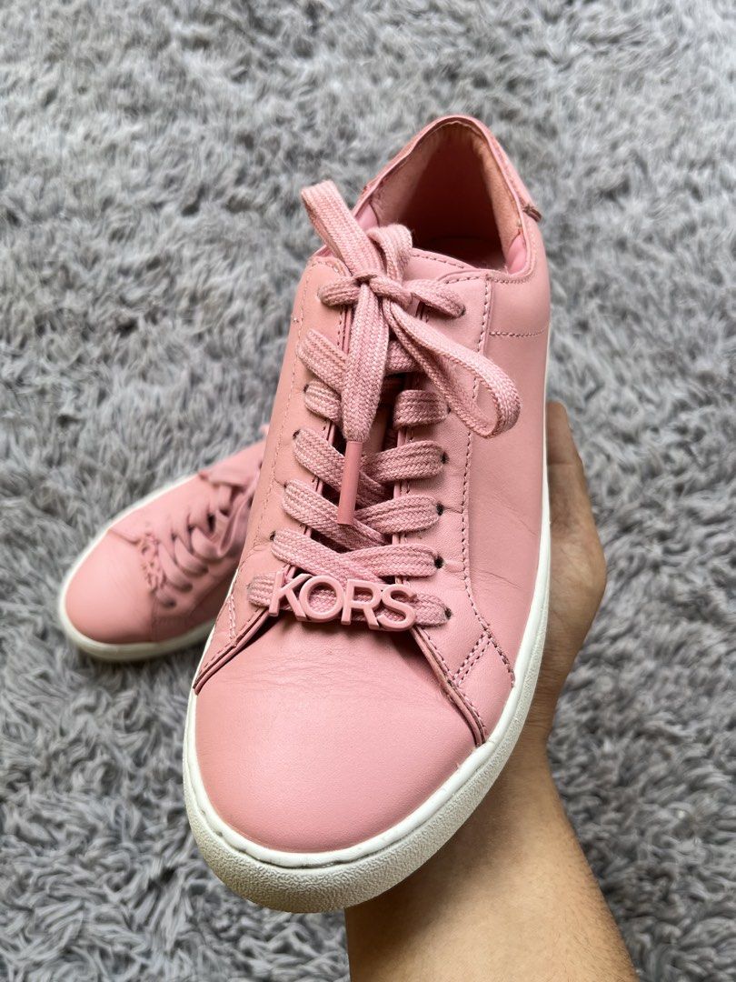 Michael Kors Pink Leather Sneakers (Category: Sneakers) located in Dipolog. Submitted by janja2002 (Listing ID 1469492666, Image 2). Description: - Brand: Michael Kors - Color: Pink with white rubber soles - Material: Premium leather upper, durable rubber tread - Features: Signature 'KORS' letter charms on laces, cushioned branded insoles - Condition: Excellent, clean uppers with minimal toe creases and very little wear on soles - Ideal for: Casu